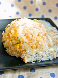 A picture of Fried Rice with a Thick Crab Sauce.