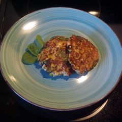 A picture of Salmon Patties with a little extra.
