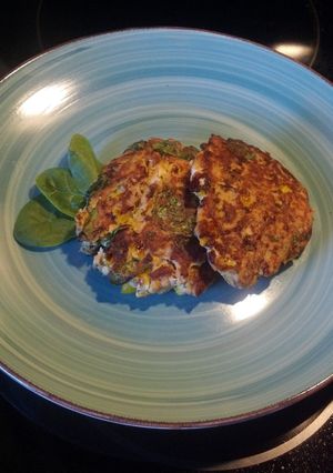 A picture of Salmon Patties with a little extra.
