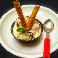 A picture of Tender Coconut Ice-cream With Chocolate Bowl.