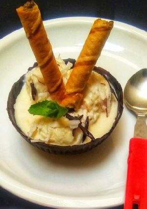 A picture of Tender Coconut Ice-cream With Chocolate Bowl.