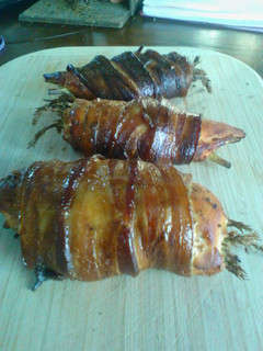 A picture of Smoked Stuffed Chicked with Asparagus Wrapped in Bacon.