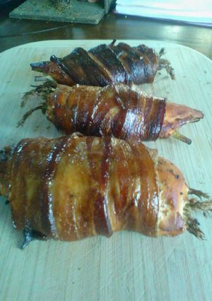 A picture of Smoked Stuffed Chicked with Asparagus Wrapped in Bacon.