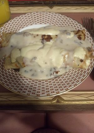 Una foto de Canelones de acelga con salsa de champiñones