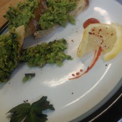 A picture of Lemon pea spread on toasted baguette.