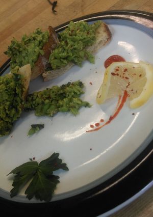 A picture of Lemon pea spread on toasted baguette.