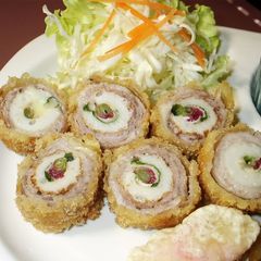 A picture of Rolled Chikuwa Fish Stick and Pork Cutlets with Plum, Shiso, and Cheese.