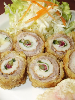 A picture of Rolled Chikuwa Fish Stick and Pork Cutlets with Plum, Shiso, and Cheese.