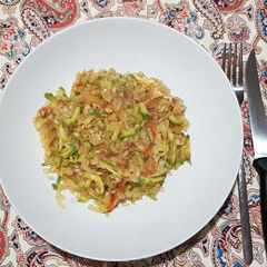 A picture of Shirataki rice with zucchini sauce.
