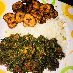 A picture of White rice and spinach sauce.