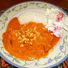 A picture of Indian-style Fish Curry With Tomatoes & Cream.