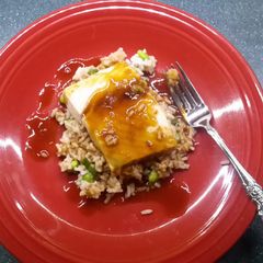 A picture of Sake glazed Halibut over rice.
