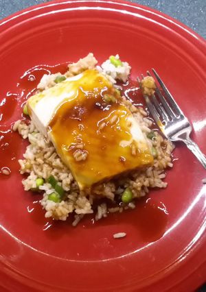 A picture of Sake glazed Halibut over rice.