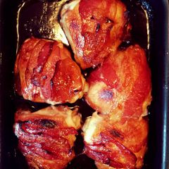 A picture of Backon wrapped chicken hips.