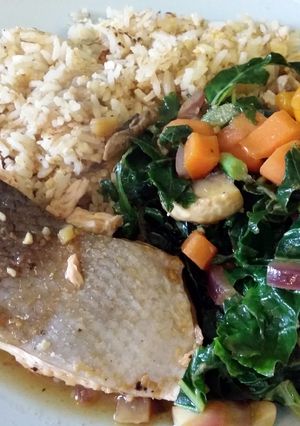 A picture of Baked teriyaki salmon with stir fried vegetables and fried rice.