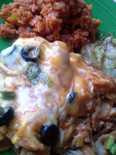 A picture of Chicken Enchiladas Spanish Rice Fried Cabbage.