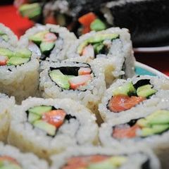 A picture of California Rolls and Seattle Rolls.