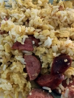 A picture of Fried Egg and sausage rice.