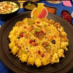 A picture of Kashmiri Pulao with burrani Raita.