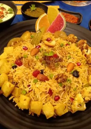 A picture of Kashmiri Pulao with burrani Raita.