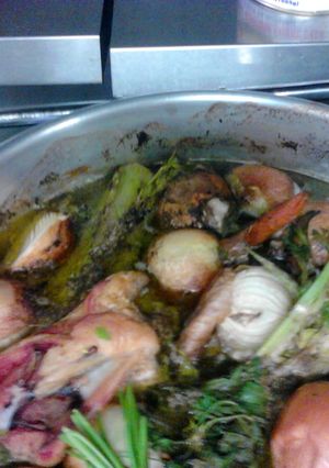 A picture of dark chicken stock.