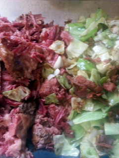 A picture of Corned beef and fried cabbage with bacon.