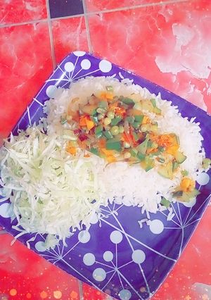A picture of White Rice with veg source.