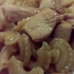 A picture of Marinated chicken and pasta.