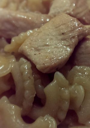 A picture of Marinated chicken and pasta.