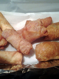 A picture of New Years appetizers pizza eggrolls, pizza wontons ,calzzones jalapeño popper eggrolls and wontons.