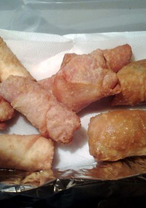 A picture of New Years appetizers pizza eggrolls, pizza wontons ,calzzones jalapeño popper eggrolls and wontons.