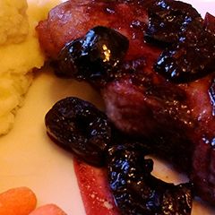 A picture of Boneless Pork Chops In A Cherry Sauce.