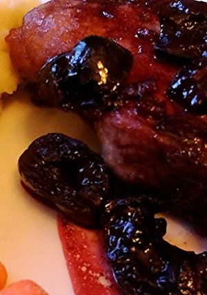 A picture of Boneless Pork Chops In A Cherry Sauce.