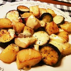A picture of German Potatoes with Melting Cheese.