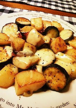 A picture of German Potatoes with Melting Cheese.