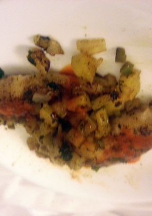 A picture of talapia with spicy pineapple.