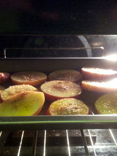 A picture of Baked apples with cinnamon and chocolate powder.
