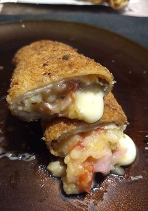 Una foto de Arrolladitos de choclo, jamón y queso!