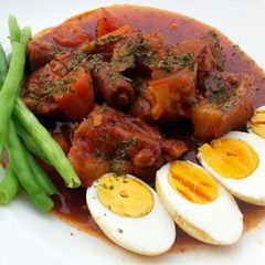 A picture of Pork And Eggs In Wine Stew.