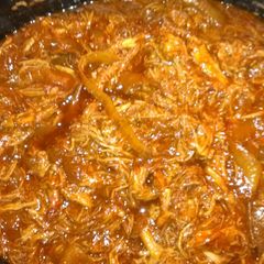 A picture of Pulled BBQ pork in a crock pot.