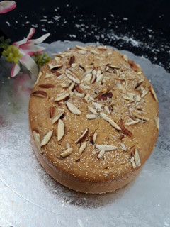 A picture of Vegan Atta Coconut Almond Cake with jaggery.