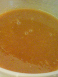A picture of Tomato and carrot soup.