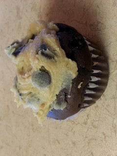 A picture of caramel chocolate cupcakes with cookie dough frosting.