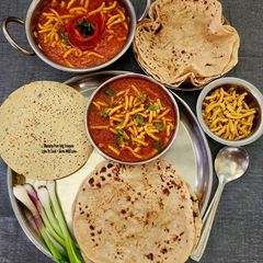 A picture of Phulka Roti - Kathiyawadi Sev Tameta Nu Shaak - Quick Easy Dhaba Style Chapati With Sev Tomato Curry.
