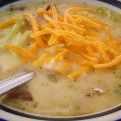 A picture of Cheesy broccoli and ham soup.