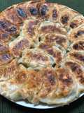 Juicy Pan-Fried Dumplings with Napa Cabbage and Garlic Chives