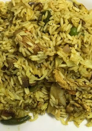 A picture of Shredded chicken with fried rice.
