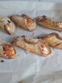 A picture of Baked Bread Cannoli with Pizza Toppings.