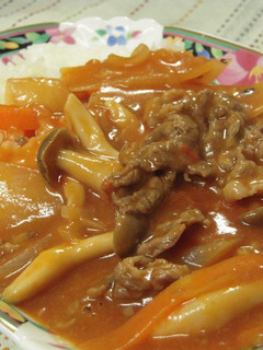 A picture of Hashed Beef Stew with Ingredients and Canned Tomatoes at Home.