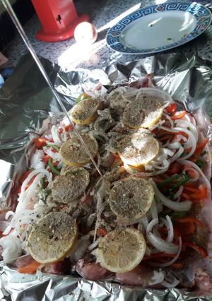 Una foto de Carpa Al Horno Con Verduras